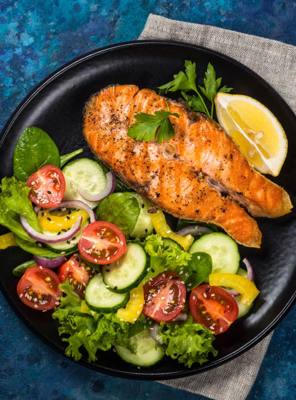 grilled-salmon-fish-steak-with-fresh-vegetables-salad-keto-diet-food-top-view-with-copy-space.jpg